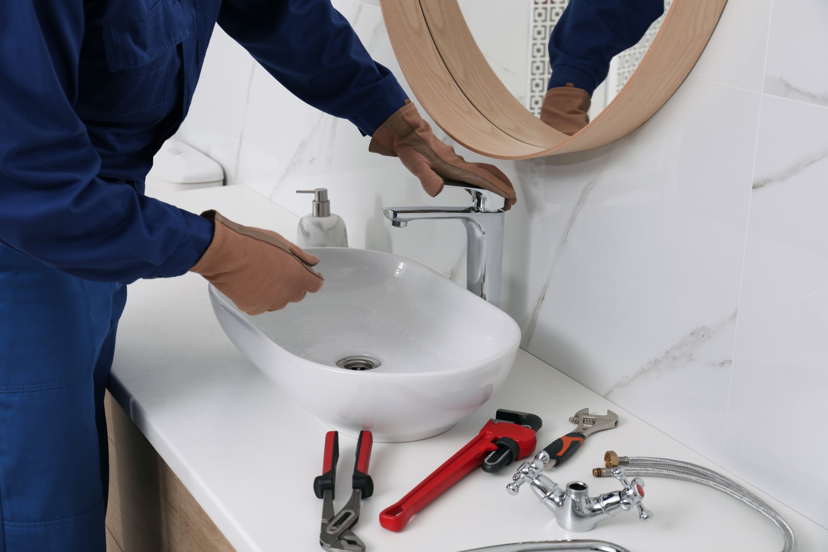 plumber repairing sink in a modern bathroom 2026 01 19 18 20 09 utc Large